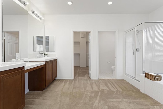 full bath featuring recessed lighting, a stall shower, and vanity