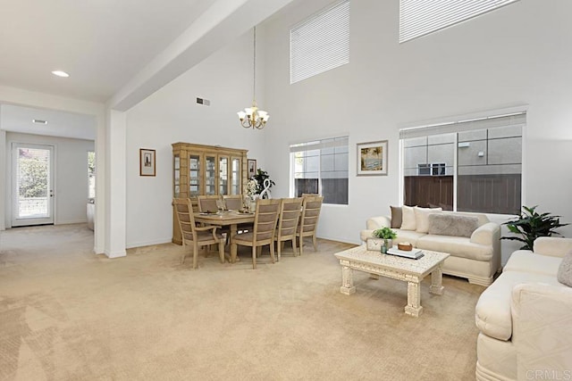 living area featuring recessed lighting, a high ceiling, carpet, an inviting chandelier, and baseboards