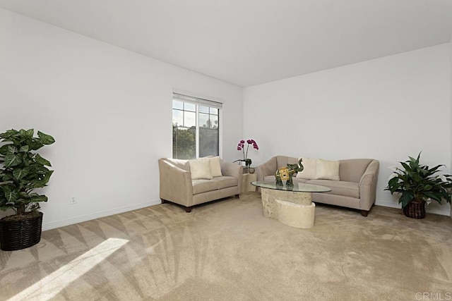 living room featuring light colored carpet and baseboards