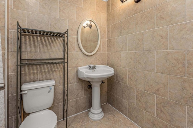 bathroom featuring tile patterned floors and toilet