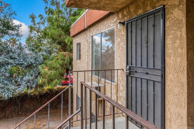 12923 Mapleview St Unit 8, Lakeside, CA 92040 - view of exterior entry featuring central air condition unit