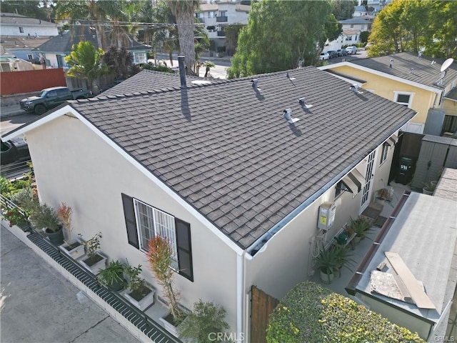 birds eye view of property with a residential view