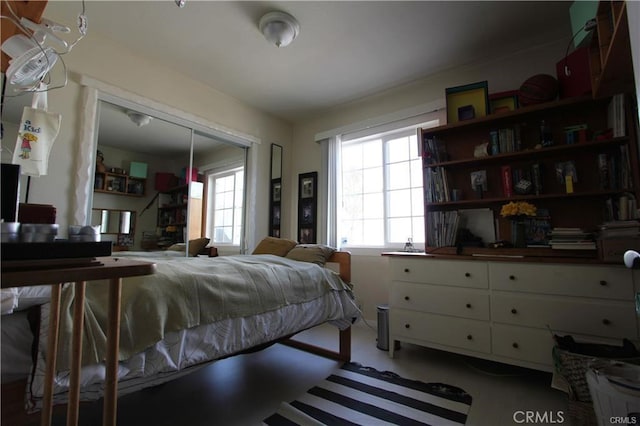 bedroom featuring multiple windows