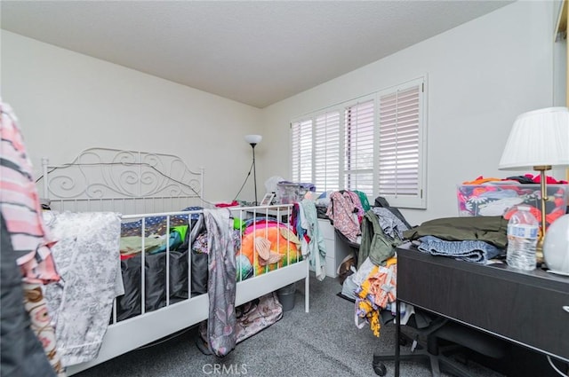 carpeted bedroom featuring a textured ceiling