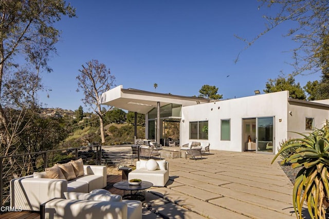 wooden deck with an outdoor hangout area