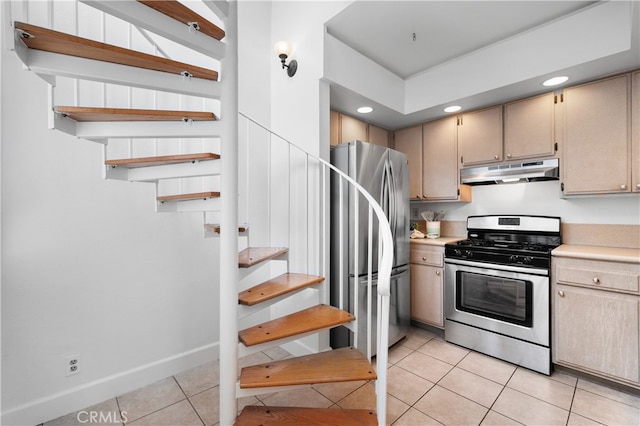 kitchen with under cabinet range hood, light countertops, light tile patterned flooring, stainless steel appliances, and open shelves