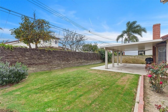 view of yard featuring a patio area and fence