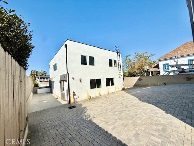 back of property featuring a fenced backyard, stucco siding, and a patio area
