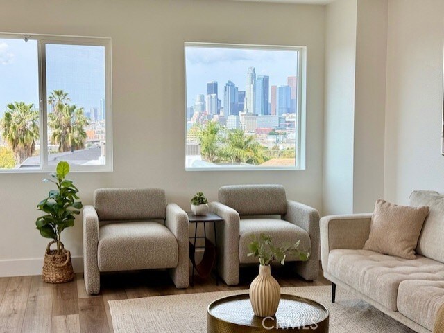 interior space with a view of city and wood finished floors