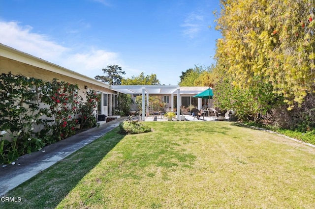 view of yard featuring a patio and a pergola