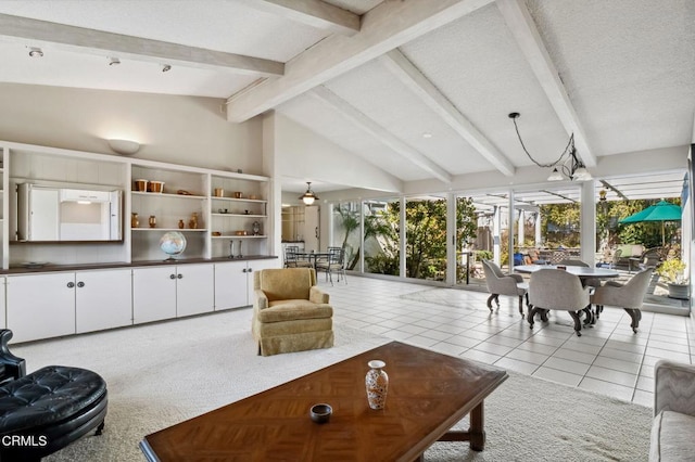 living area with light tile patterned flooring and vaulted ceiling with beams