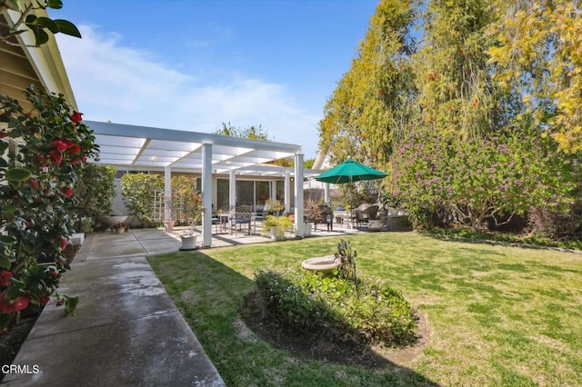 view of yard with a patio and a pergola