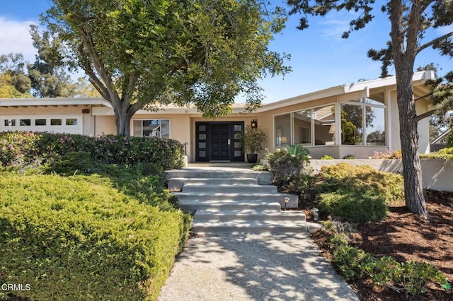 view of front of property featuring stucco siding