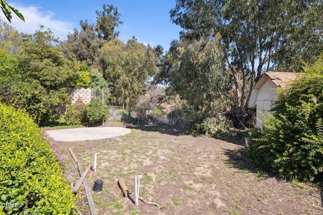 view of yard featuring a patio and fence