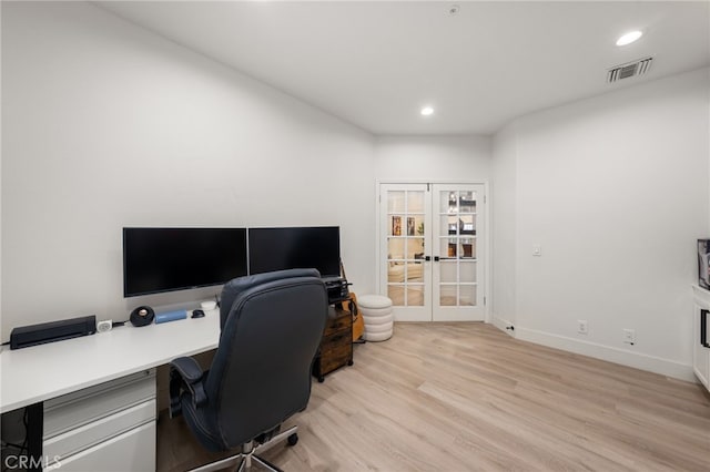 office featuring visible vents, light wood-style flooring, recessed lighting, french doors, and baseboards