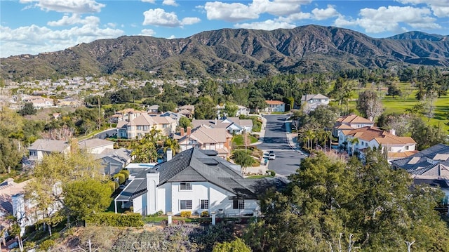 drone / aerial view with a mountain view and a residential view