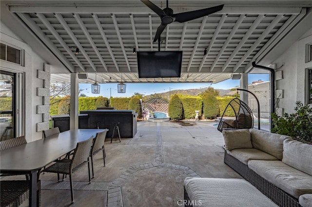 view of patio featuring an outdoor living space, outdoor dining area, and a hot tub