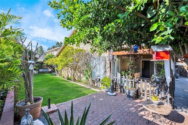 view of yard featuring a patio and fence