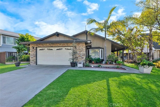 view of front facade with stone siding, an attached garage, driveway, and a front yard