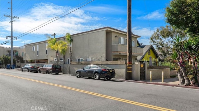 view of building exterior with a fenced front yard