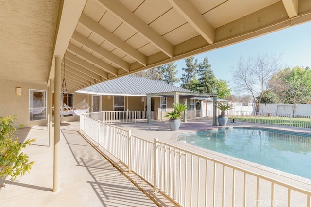 view of swimming pool with a fenced in pool, a patio area, and fence