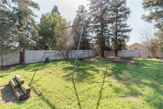 view of yard with a fenced backyard