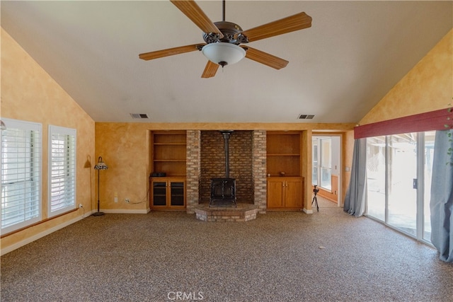 unfurnished living room featuring built in features, visible vents, and lofted ceiling