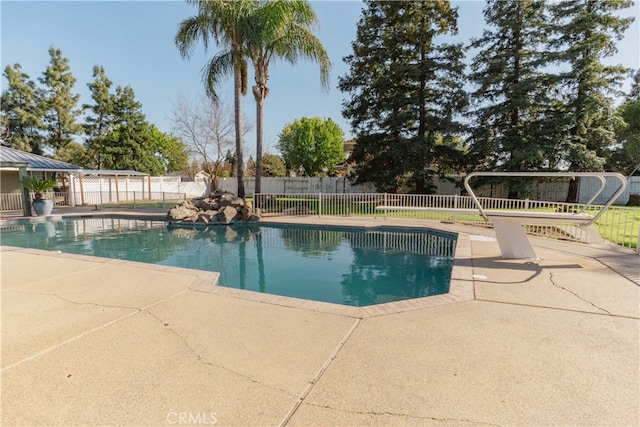 view of pool with a fenced in pool, a patio area, and fence