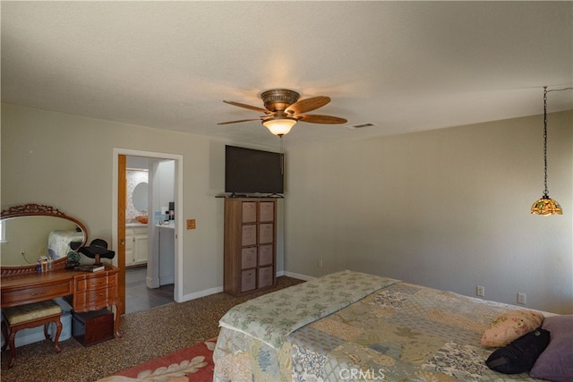 bedroom with visible vents, ensuite bathroom, carpet flooring, baseboards, and ceiling fan