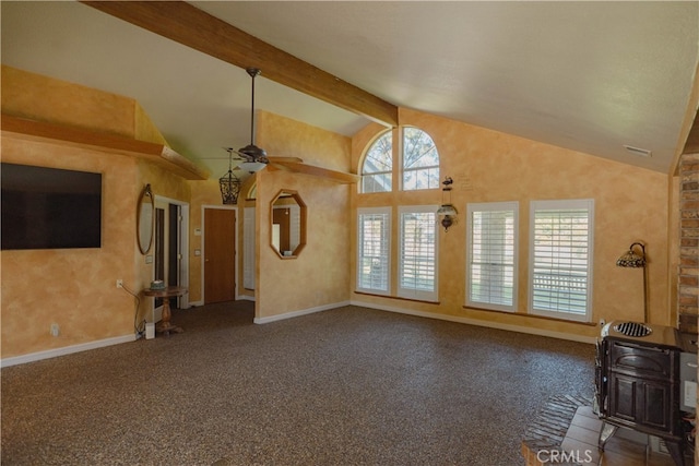 unfurnished living room featuring beam ceiling, carpet flooring, baseboards, and ceiling fan