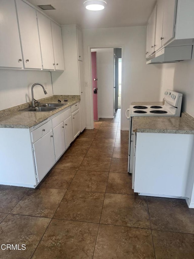 kitchen with under cabinet range hood, light countertops, white range with electric stovetop, white cabinetry, and a sink