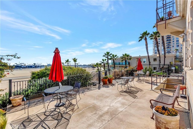 1030 E Ocean Blvd Unit 110, Long Beach, CA 90802 - view of patio / terrace featuring fence and outdoor dining area