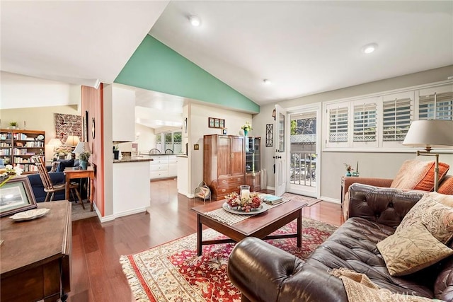 living room with recessed lighting, baseboards, dark wood-style flooring, and vaulted ceiling