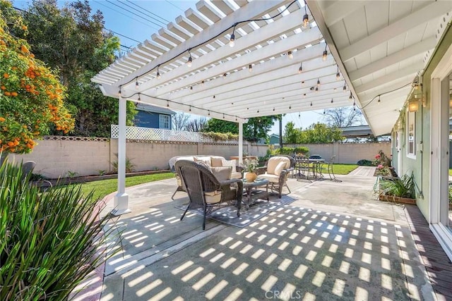 view of patio / terrace with outdoor lounge area, a fenced backyard, and a pergola