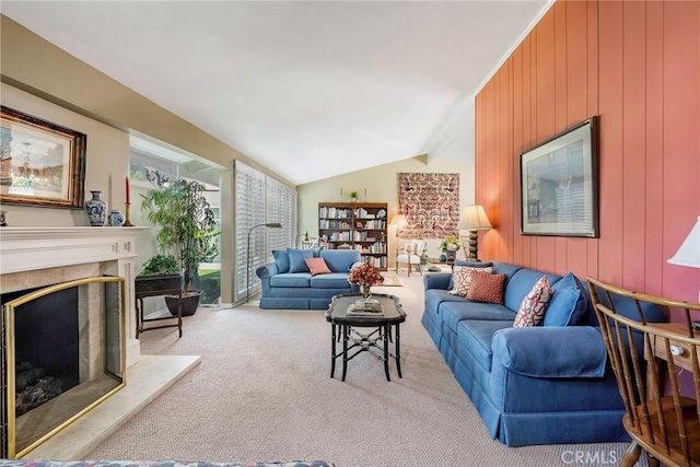 carpeted living area with lofted ceiling with beams, wooden walls, and a high end fireplace