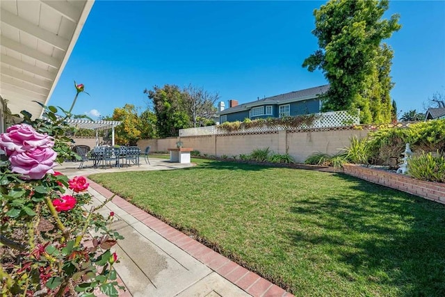 view of yard with a patio area, a pergola, and a fenced backyard