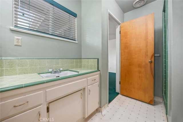 bathroom featuring tile patterned floors and vanity