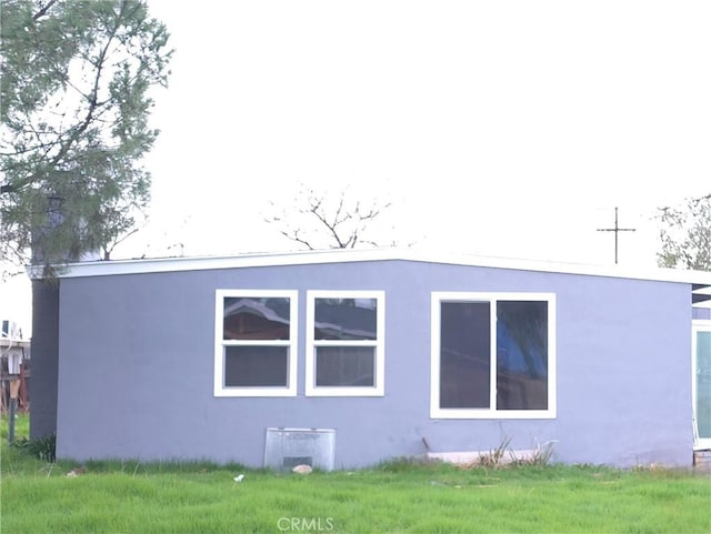 rear view of property with stucco siding