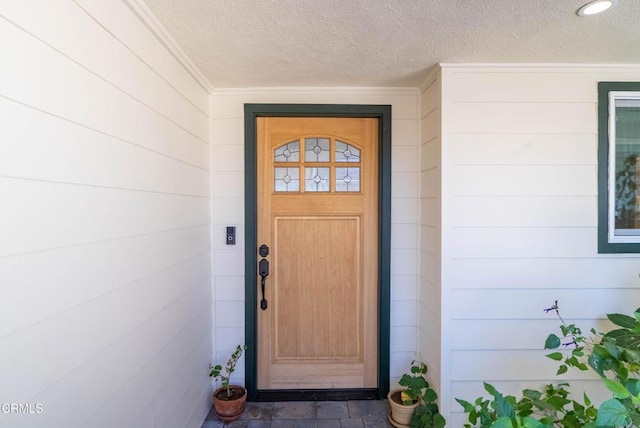 entrance to property with concrete block siding