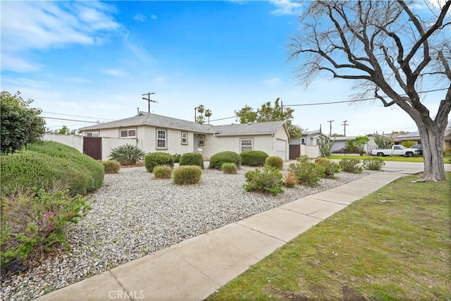 view of side of property featuring stucco siding and a yard