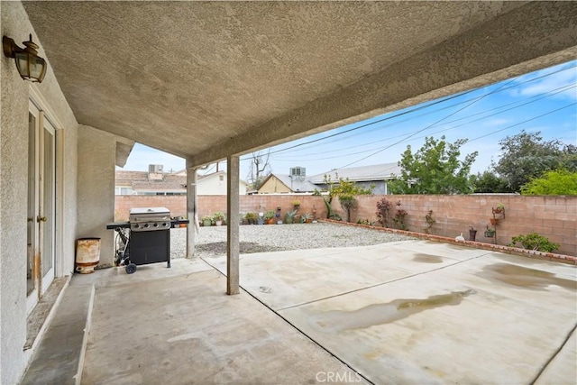 view of patio / terrace featuring area for grilling and a fenced backyard