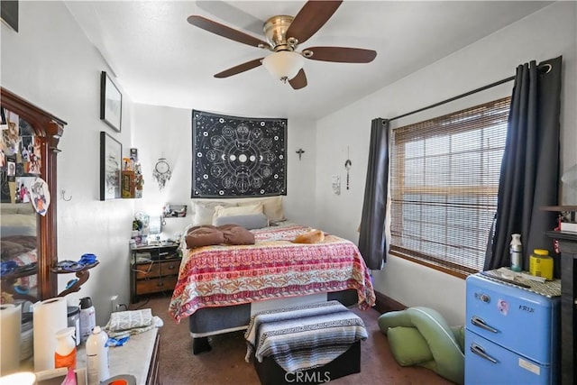 carpeted bedroom with a ceiling fan