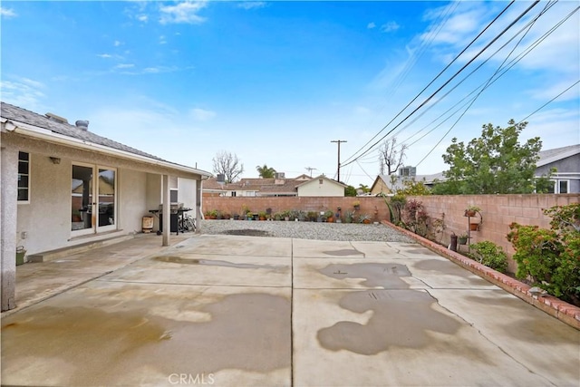 view of patio featuring area for grilling and a fenced backyard