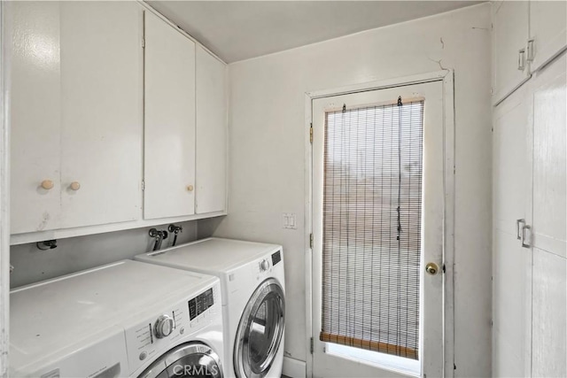 laundry room with cabinet space and independent washer and dryer