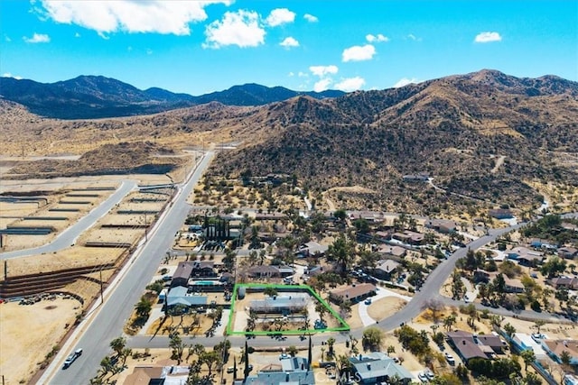 birds eye view of property featuring a mountain view