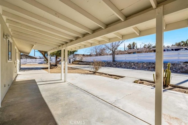 view of patio featuring fence