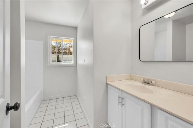 full bath with tile patterned floors, baseboards, and vanity