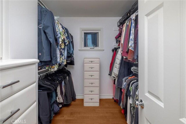 spacious closet with light wood-style floors