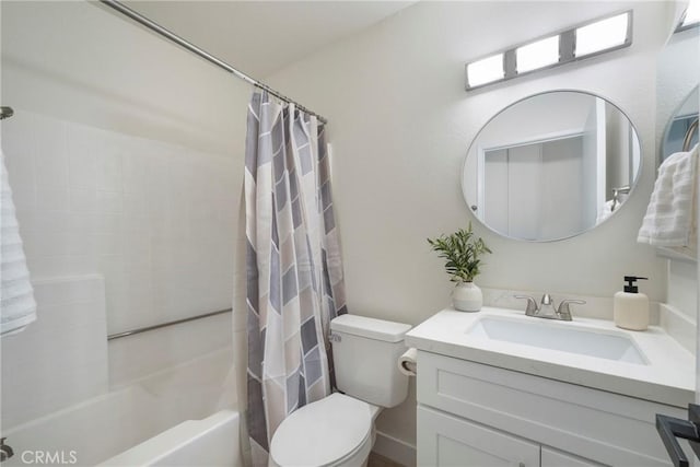 bathroom with vanity, toilet, and shower / tub combo with curtain