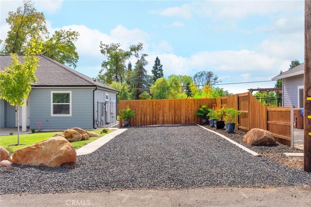 view of yard with a gate and fence